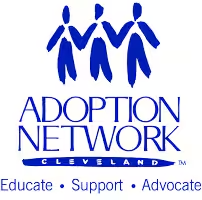 Mechanic working under a raised car in an automotive service garage.